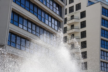 High jets of water fountain in the city close upの写真素材