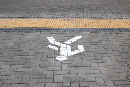 Symbol of the footpath on the sidewalk close upの写真素材
