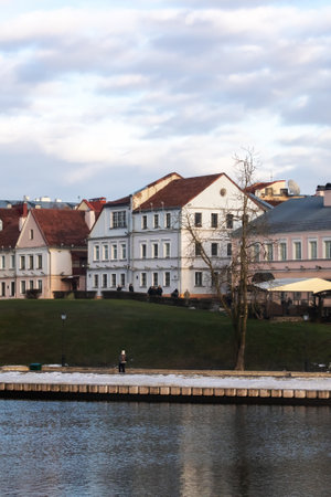 Belarus, Minsk - 04 January, 2023: Old houses on the banks of the river