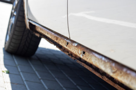 Rotten sills of an old gray carの写真素材