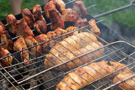 Meat and sausage on a grill close upの写真素材