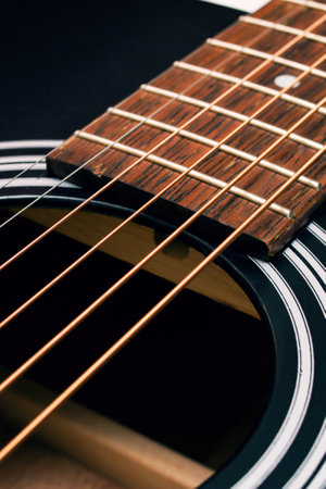 Black and yellow guitar strings close up macro photography