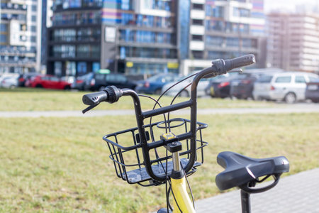 The steering wheel of an electric scooter against the background of the cityの写真素材