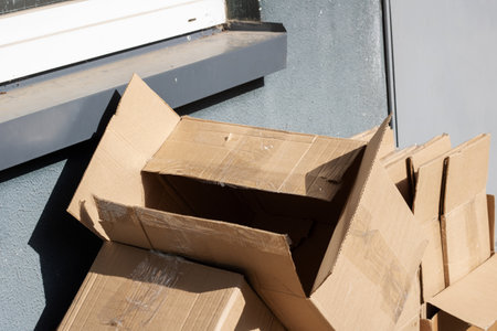 Empty cardboard boxes after moving close up in sunlightの写真素材