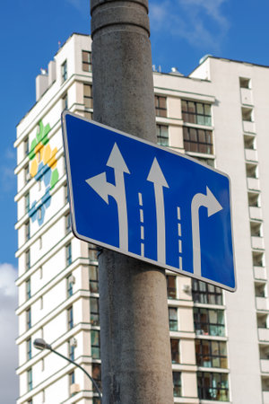 Blue road sign with arrow pointers close upの写真素材