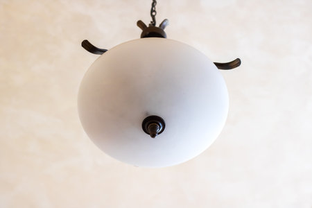 White old lamp on the ceiling close upの写真素材