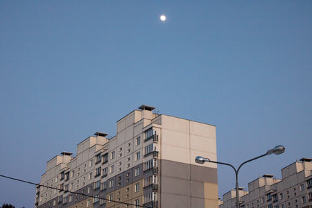 Upper floors of a tall house at sunset close upの写真素材