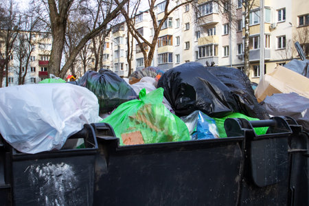 Black big garbage cans on asphalt close upの写真素材