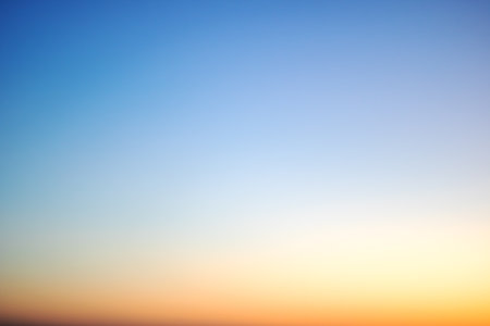Blurred blue sky at sunset close up, graphient backgroundの写真素材