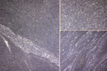 Old gray paving slabs close up, background or textureの写真素材