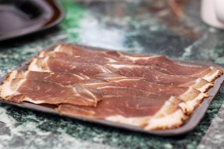 Red cuts of salted meat close up, macrophoto