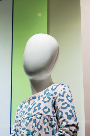 Baby mannequin in bright clothes in store close upの写真素材