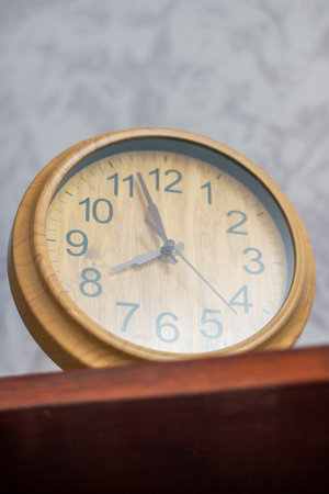 a close up of a wooden clock which shows the time