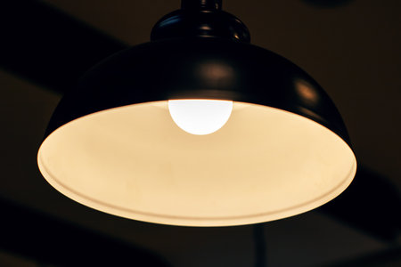 A lamp that emits a bright white light from within it and illuminatesの写真素材