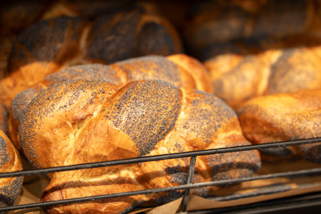 A delightful assortment of bread rolls sprinkled with poppy seedsの写真素材