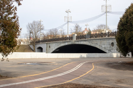 The scenery features a road that stretches forward, complemented by a bridge visible in the distant...