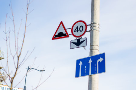There is a traffic sign affixed to a pole that prominently displays the number 40 on it, indicating...