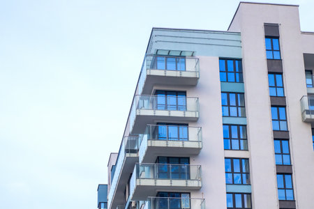 A large and impressive building that numerous features windows along its facade and multiple...