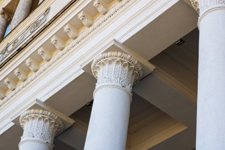 A majestic building features impressive columns prominently displayed at the front of its structure,...