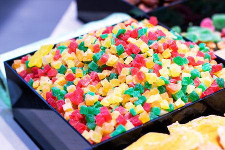 A mysterious black box filled to the brim with a delightful variety of colorful candies in all...