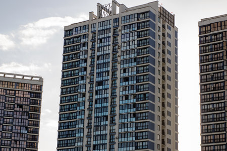 A perfectly enormous and very tall building that features an extensive amount of windows, shining...