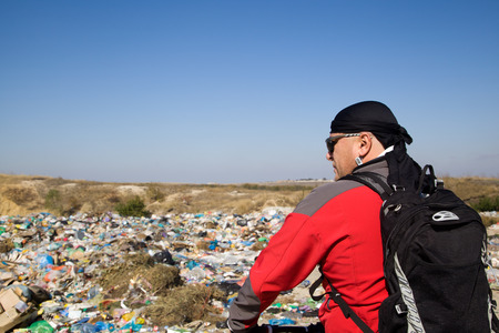 Landfill household waste on a background of blue skyの写真素材