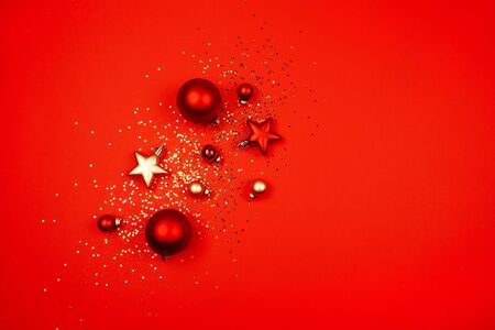 Five red christmas decoration ball on a red background with space for text Sequins, snowflakes, New Year concept.の写真素材
