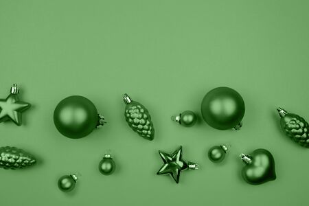 Christmas border. Christmas balls, garland, mint decorations on background. Flat lay, top view, copy space. Trandy color of 2020 year.の写真素材