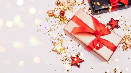 Christmas New Year Celebration Decorations Concept. Gold box and stars, sparkles, lights