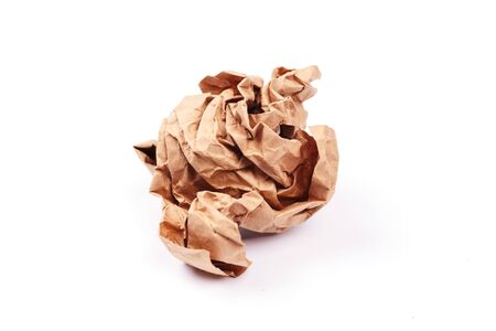 Crumpled craft paper sheet on isolated background.の写真素材