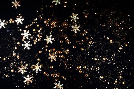 Garland of golden stars on a black background.