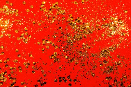 Red Christmas texture. red glitter texture valentine's day background with gold sparkles.の写真素材
