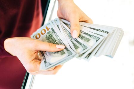 Woman counting money banknotes.Concept photo of money, banking ,currency and foreign exchange rates.
