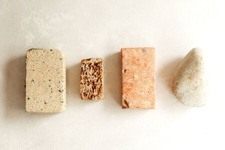 Pieces of different natural stones on a light background, eco concept, different texture, gravity,...
