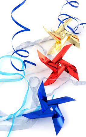 Pinwheel  gold, red and blue on white backgroundの写真素材