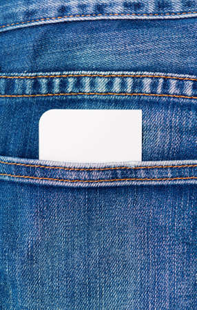 Blank white card peeking out of a rear denim jeans pocket ready for your message or textの写真素材