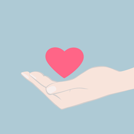 illustration of a hand cupping a red heart offering it as a token of love and affection to a sweetheart or loved one, card design with copyspaceのイラスト素材