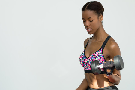 African woman demostrates how to do exercisesの写真素材