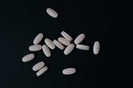 A lot of pills on black backgroundの写真素材