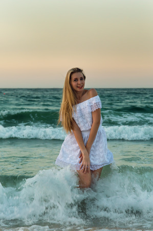Blond gilr in the waterの写真素材