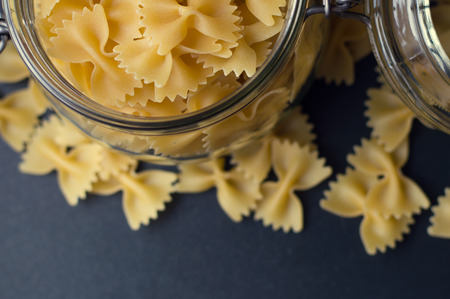 Background with a lot of italian farfalle, view from aboveの写真素材