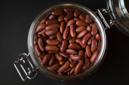 Red kidney beans in a food container made of glassの写真素材