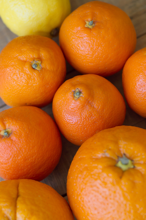 Vertical background with citrus fruits: tangerine, lemon and orangeの写真素材