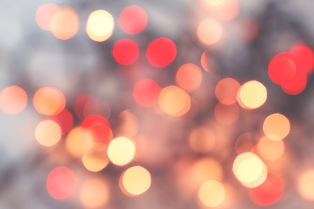 Abstract background with blurred lights of red and yellow color. Festive atmosphere