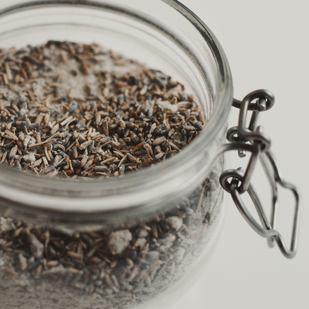 Jar with homemade body scrub with salt and lavender. Body care. Spa treatment conceptの写真素材