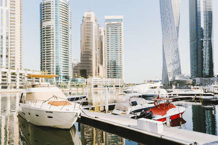 Dubai; UAE - June 6, 2020: Luxury yachts and boats at Dubai Marina early in the morning. Residential area and popular tourist destination in Dubaiのeditorial素材