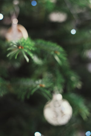 Blurred Christmas tree and ornaments background. New Year and Christmas celebrationの写真素材