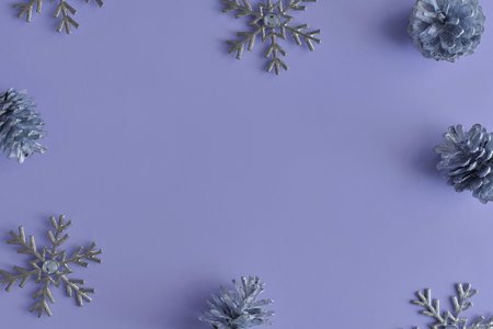 Background with christmas ornaments. Silver snowflakes and pine cones. Winter season concept, copy spaceの写真素材