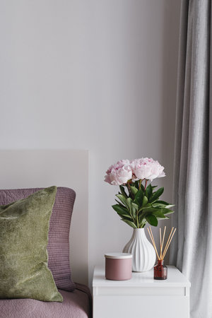 Simple Bedroom Styling with Pastel Pink Peonies in a Ceramic Vase, Scented Candle, Reed Diffuser....