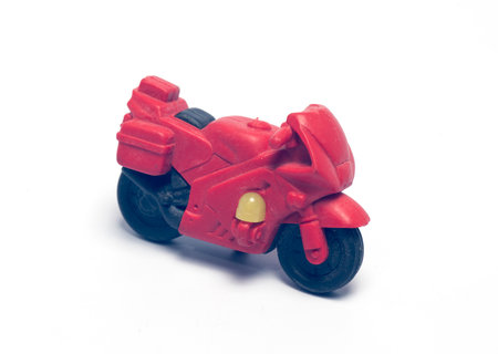 rubber toy motorcycle on white backgroundの写真素材